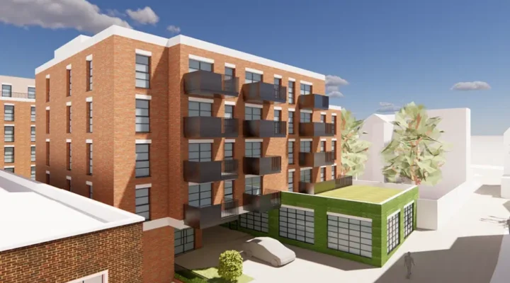 Modern brick apartment building with balconies.