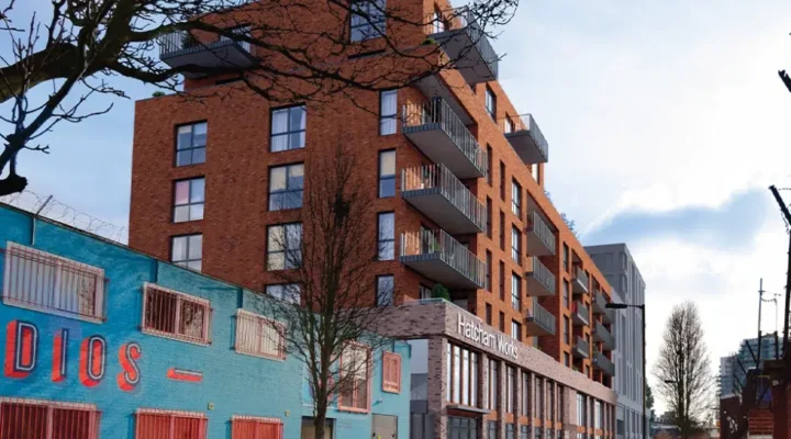 Modern apartment building with street view.