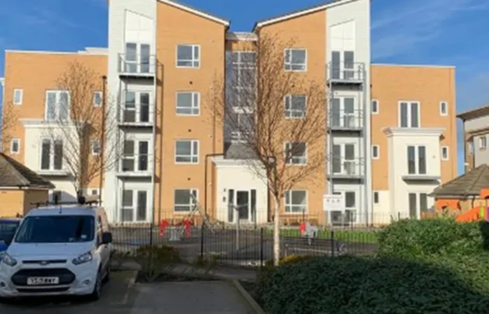 Modern apartment building with parking area