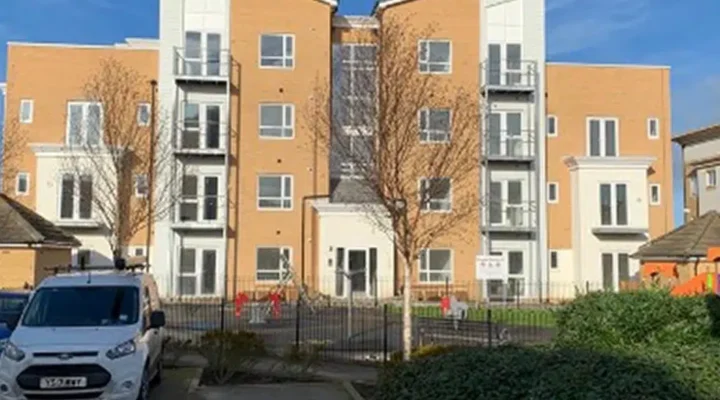 Modern apartment building with parking area