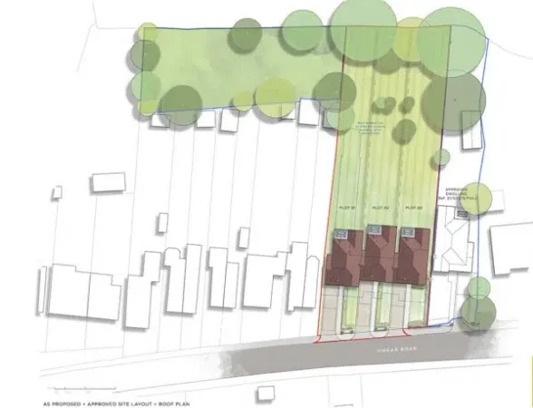 Site layout plan with houses and trees.