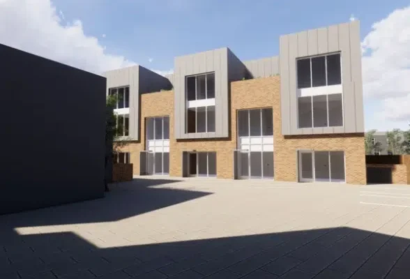 Modern building with three storeys and large windows.