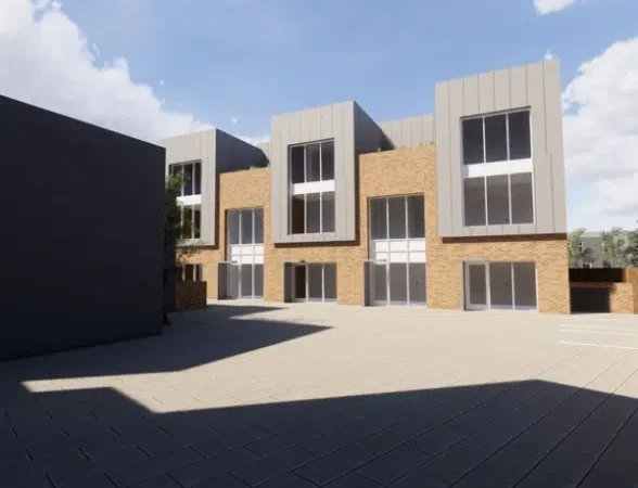Modern building with three storeys and large windows.