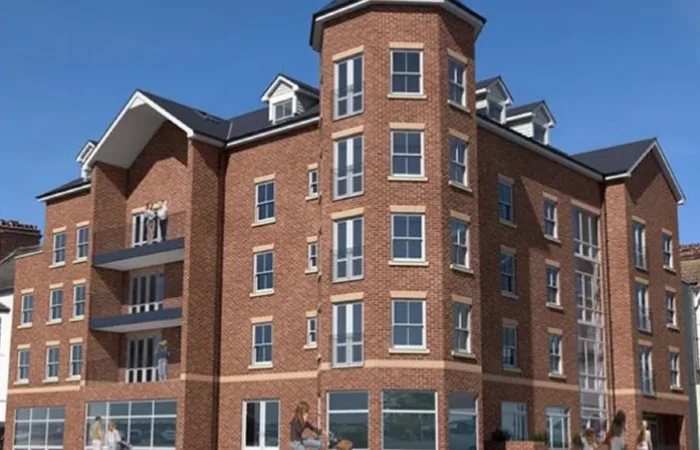 Modern brick apartment building with balconies.