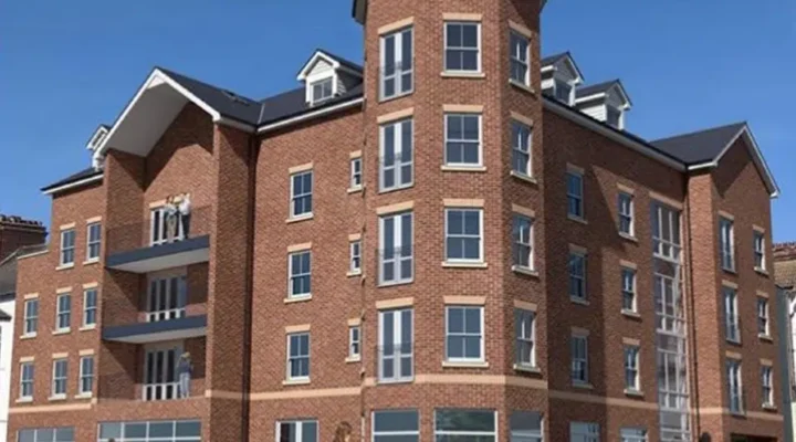 Modern brick apartment building with balconies.