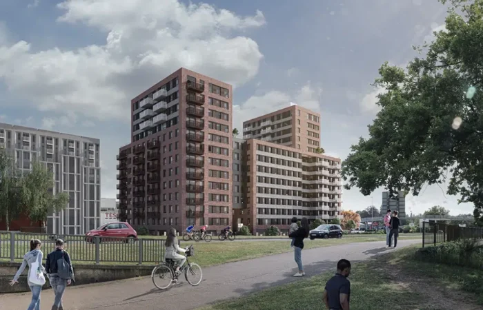 Modern flats with pathways and people outdoors.