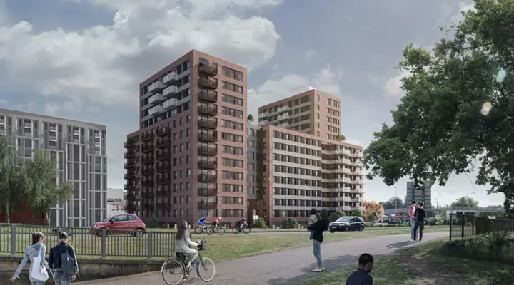 Modern flats with pathways and people outdoors.