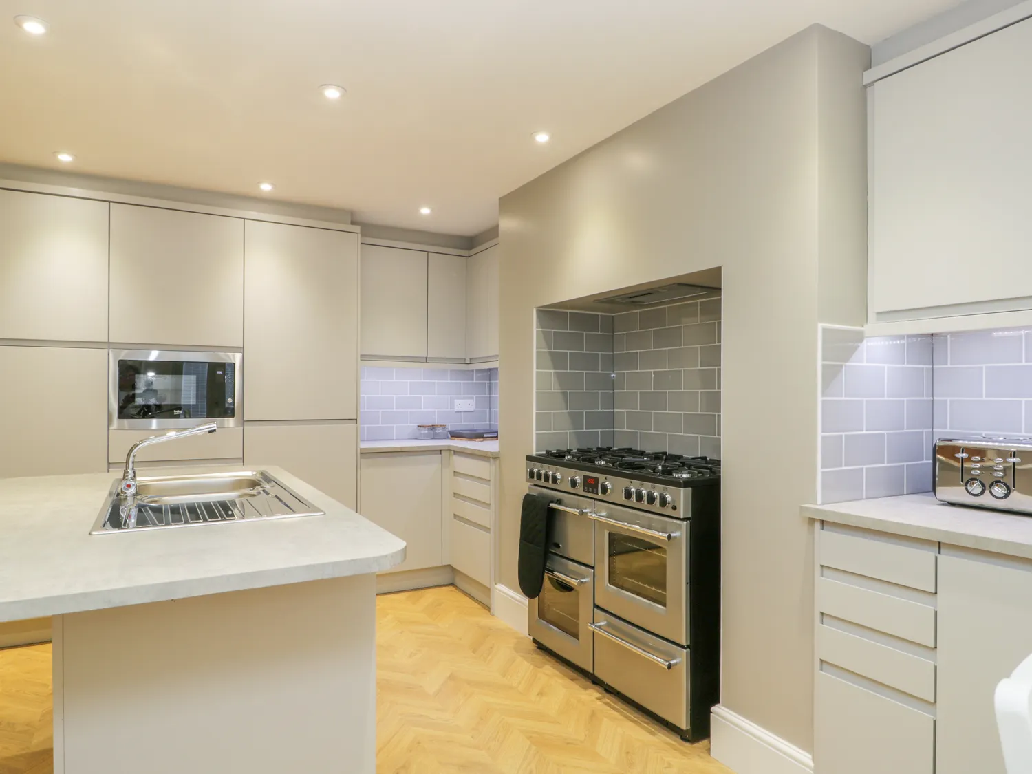Modern kitchen with sleek design and appliances.