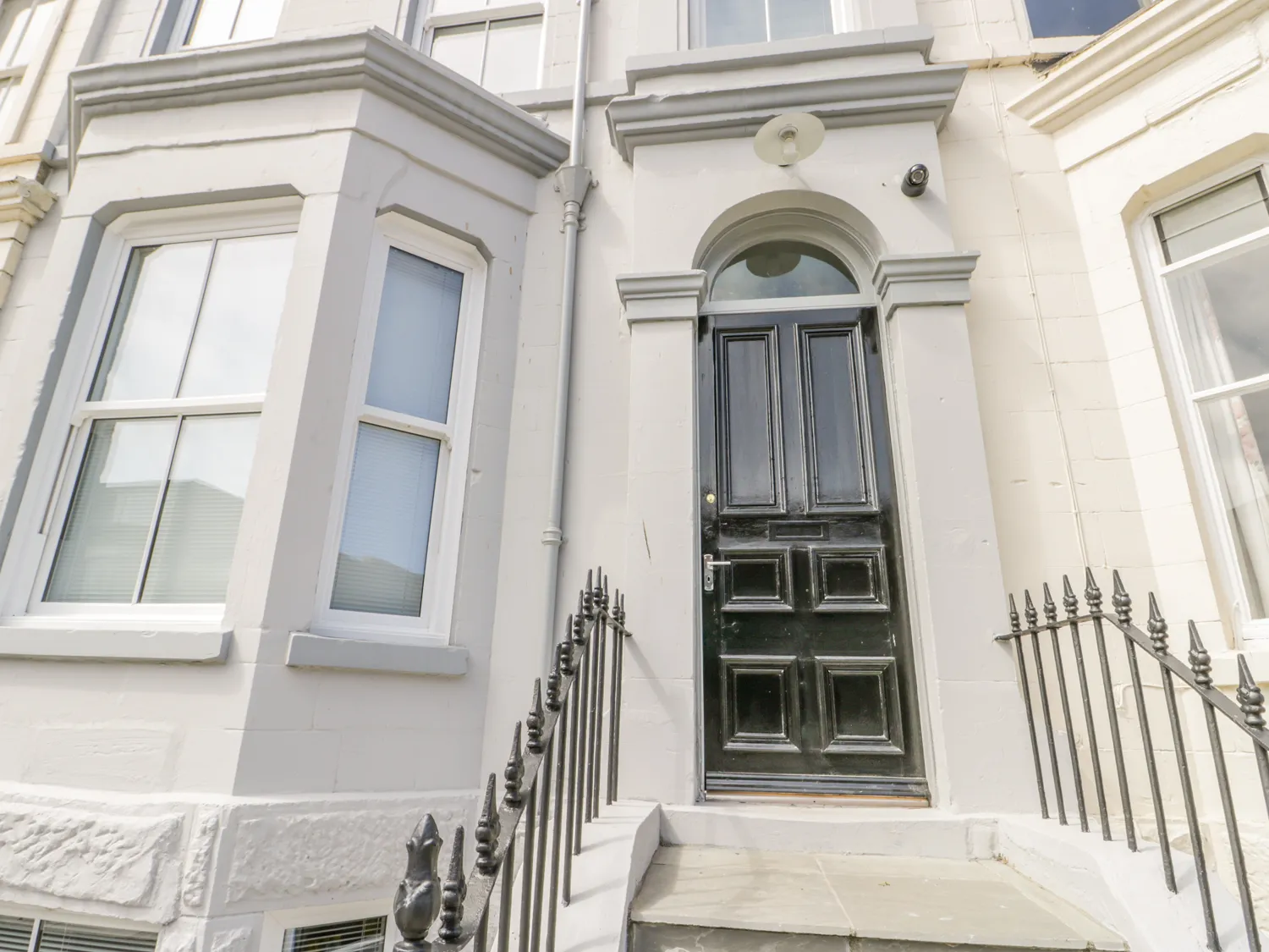 Victorian townhouse entrance with black door