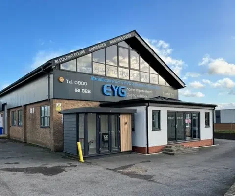 Exterior of EYG showroom and factory building.