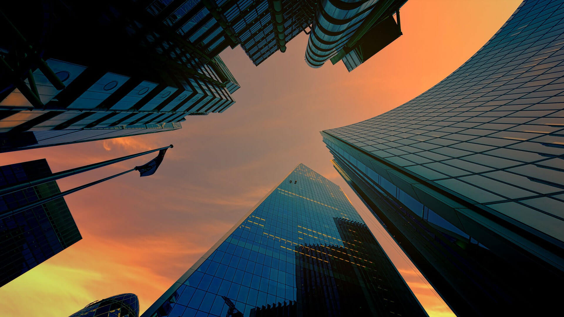 City skyscrapers against sunset sky